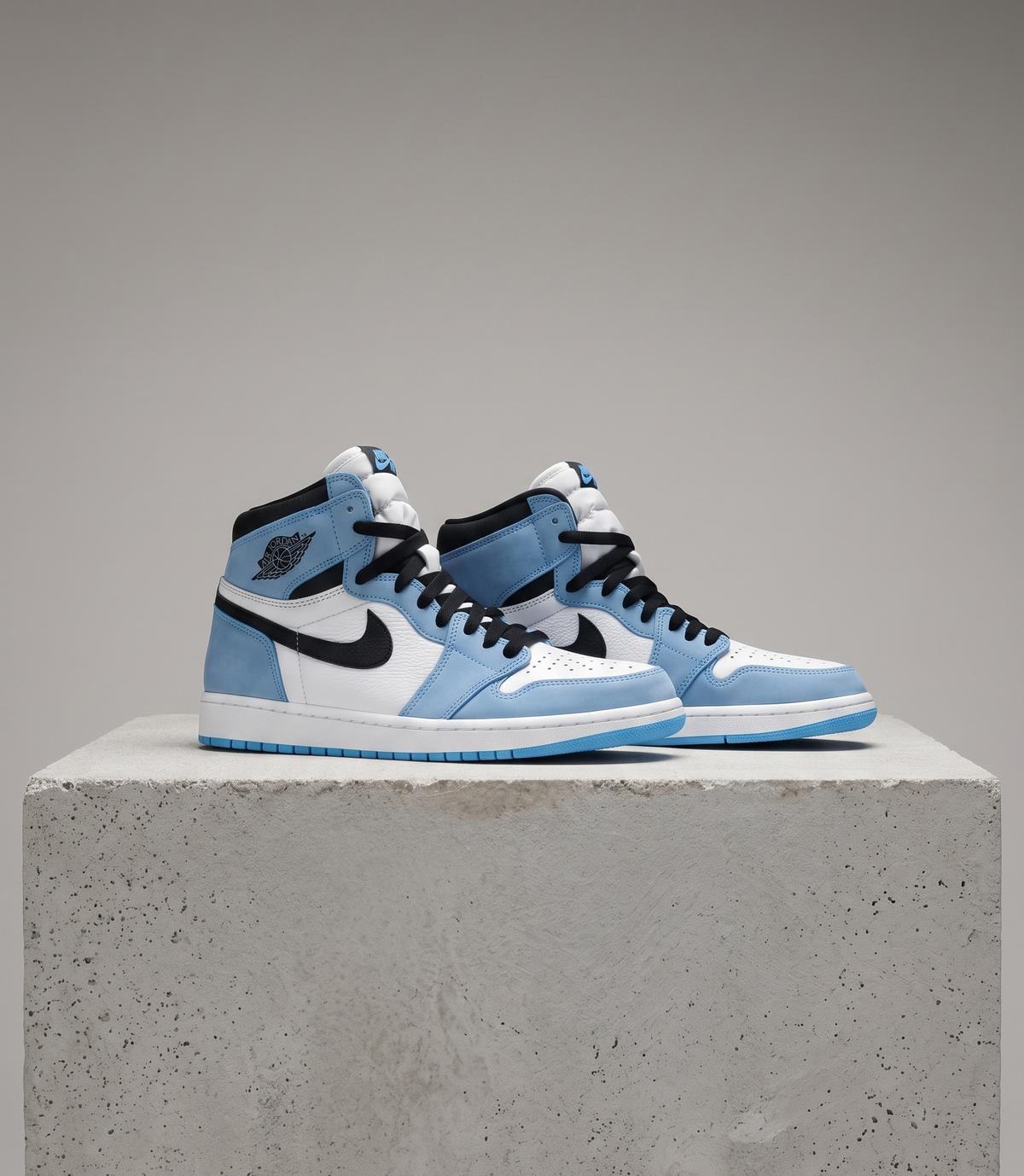 Air Jordan 1 Retro High OG University Blue, three-quarter front view of the pair
