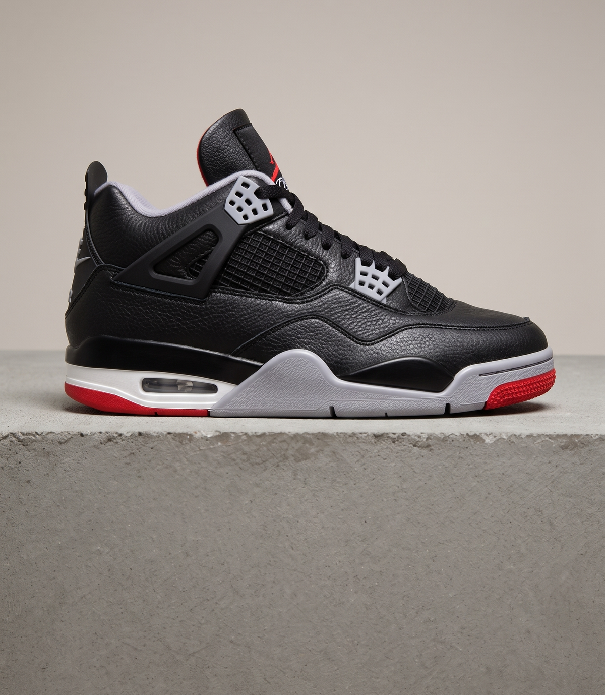 Air Jordan 4 Retro Bred Reimagined, side profile studio photograph