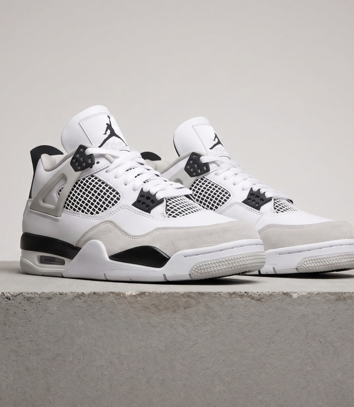 Air Jordan 4 Retro Military Black, three-quarter front view of the pair