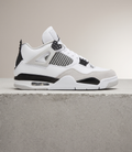 Air Jordan 4 Retro Military Black, side profile studio photograph