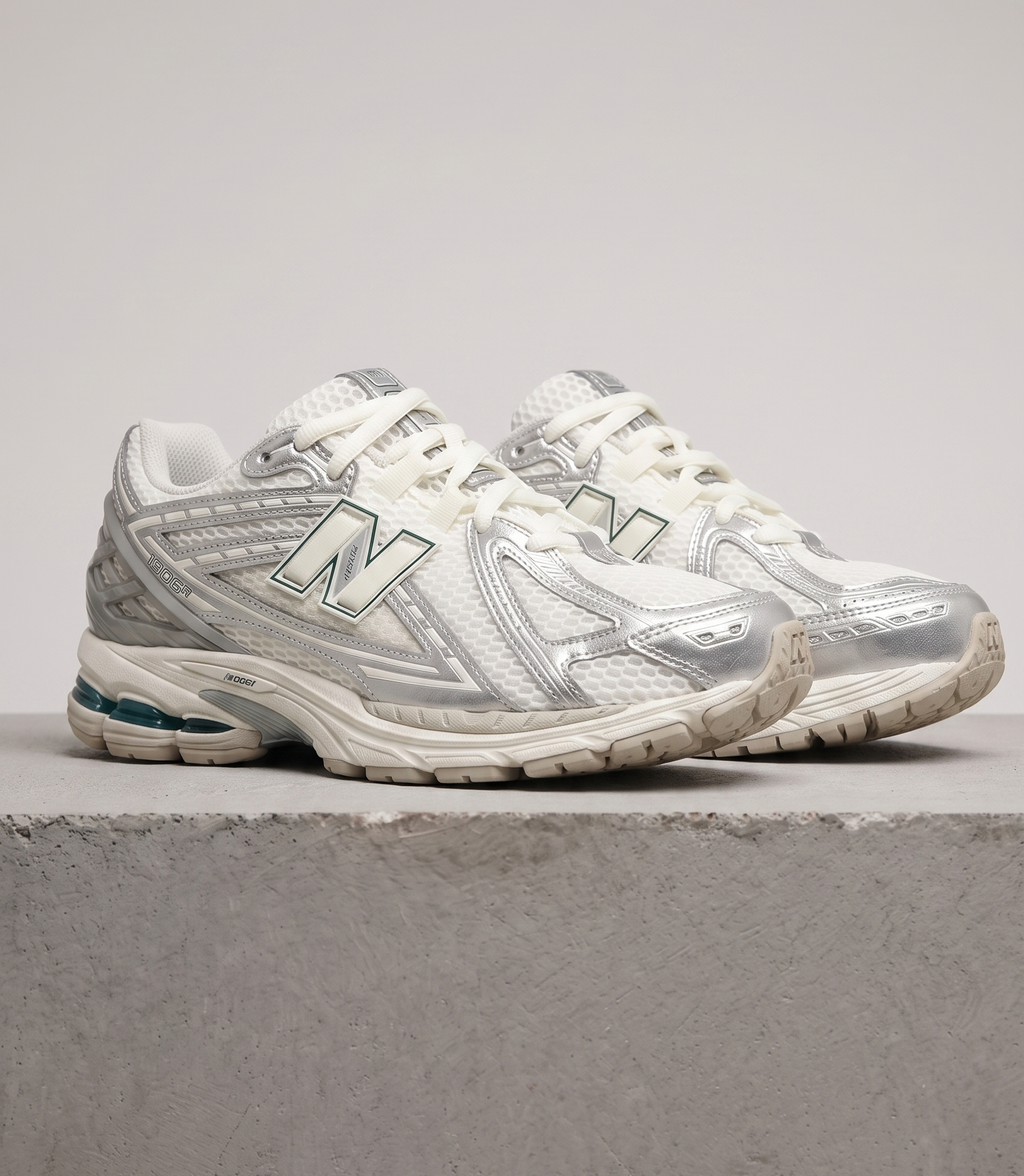 New Balance 1906R Silver Metallic Cream, three-quarter front view of the pair