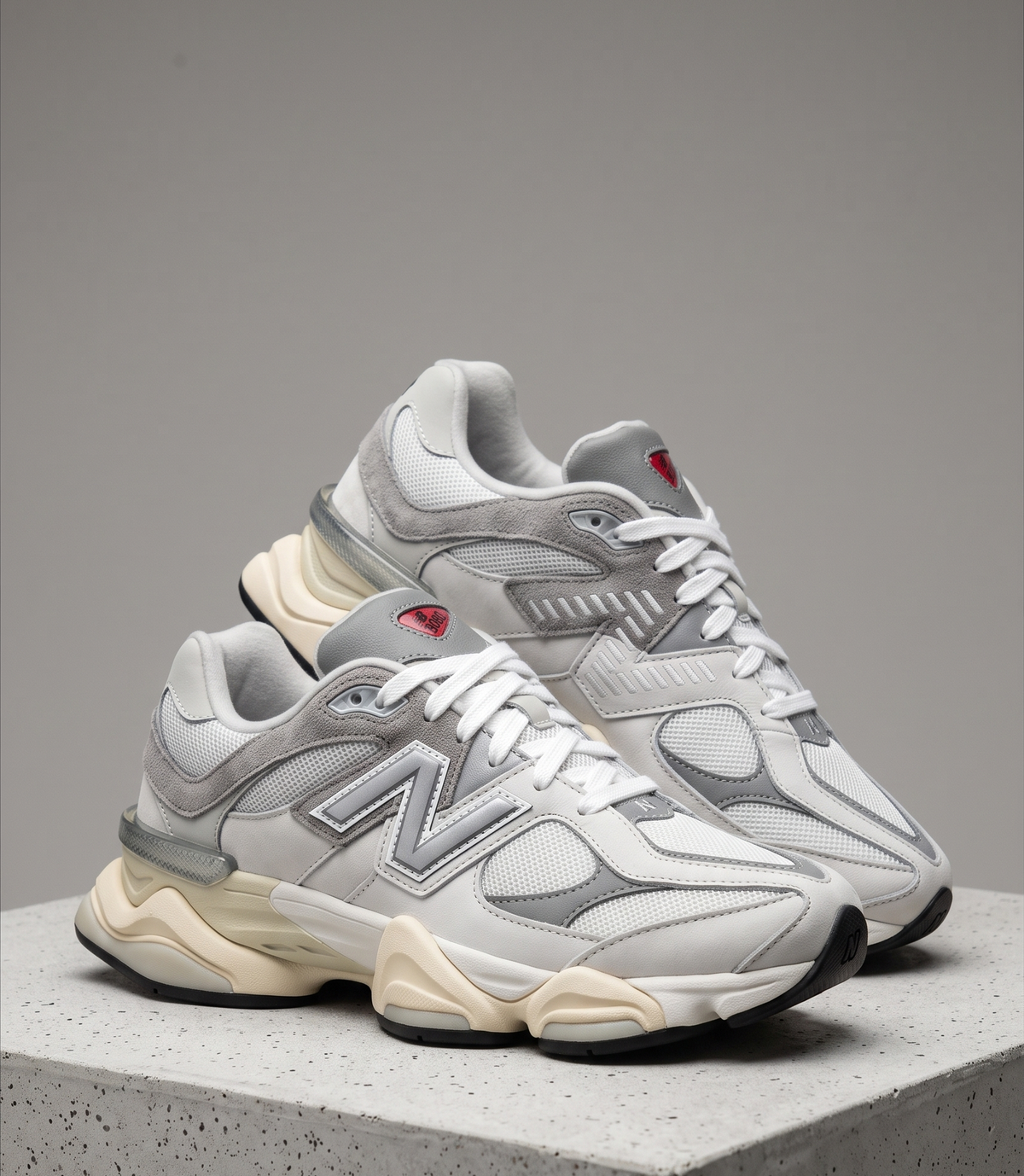 New Balance 9060 Rain Cloud, three-quarter front view of the pair