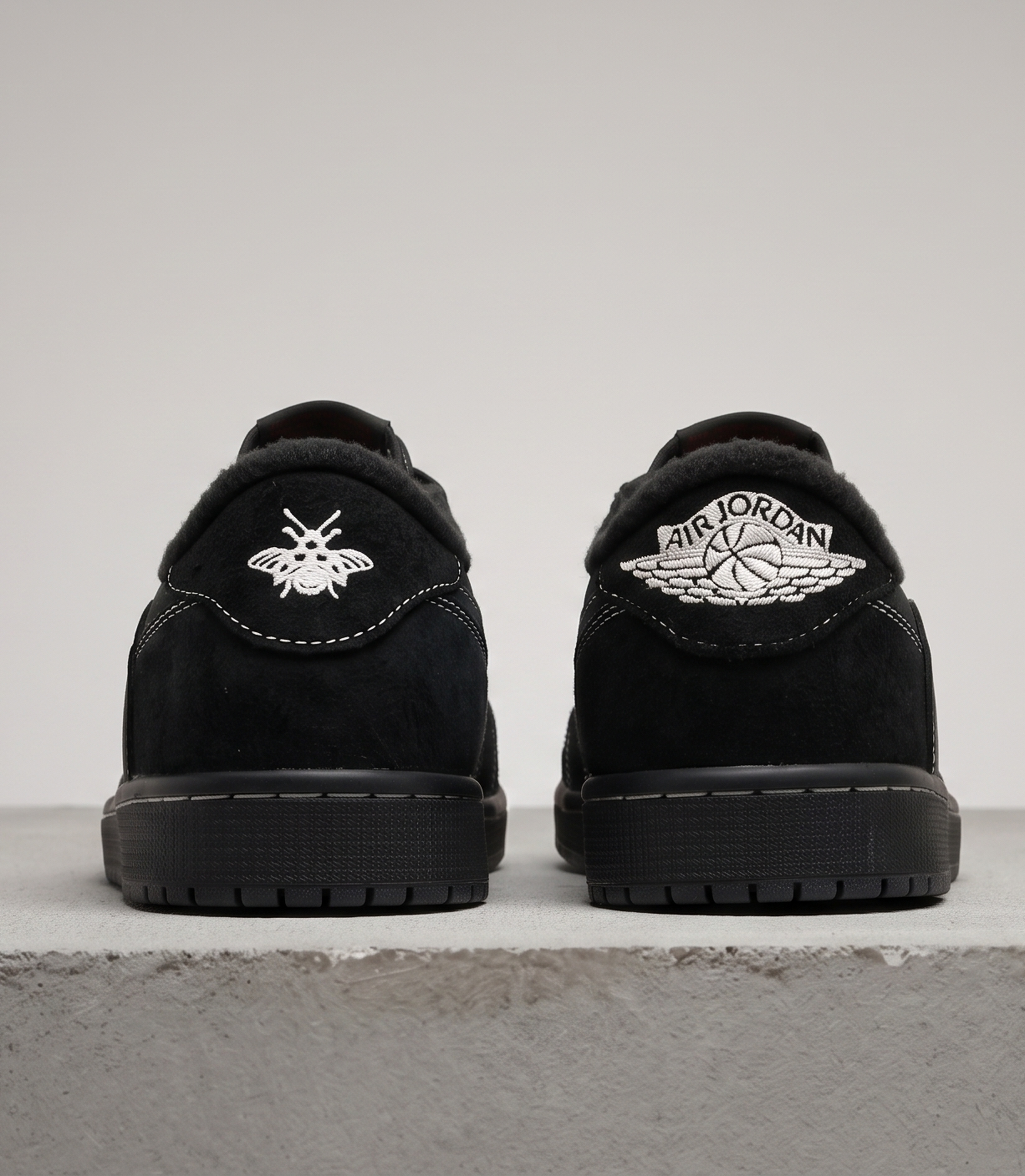 Travis Scott x Air Jordan 1 Low Black Phantom, heel view with bee and wings logos