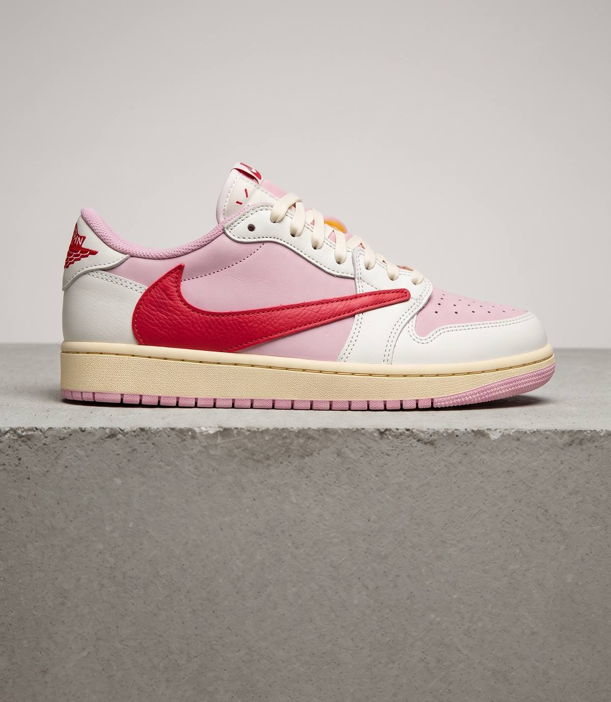 Travis Scott x Air Jordan 1 Low OG Tropical Pink, side profile studio photograph